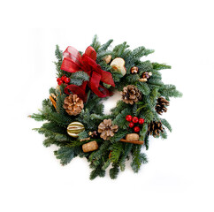 Fototapeta na wymiar Evergreen homemade Christmas wreath, decorated with Christmas balls, on a white background