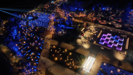 Aerial drone night distant shot from illuminated with Christmas lights futuristic Ellinikon...
