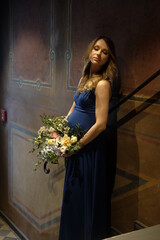 Pregnant woman with spring flowers