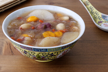 Snow Fungus soup with fruits and almonds. Sweet soup from Chinese cuisine.