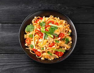 Chicken Pad Thai with eggs, bean sprouts, peanuts and spring onion.