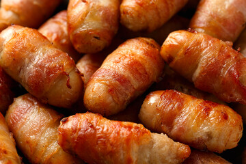 Pigs in blankets with ketchup and mustard sauce. Party food