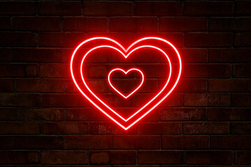 Neon red heart three in one against a dark brick wall.