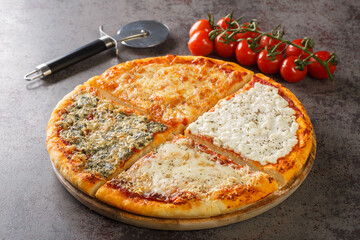 Homemade traditional Italian four cheese pizza with tomato sauce, gorgonzola, ricotta, parmesan and...