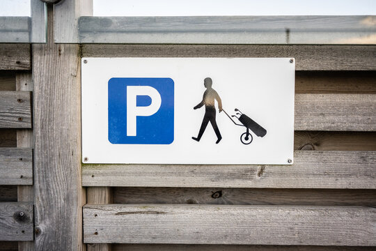 Sign marking golf caddy parking.
