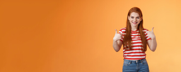 Skilful good-looking redhead motivated girl, pointing herself, indicate fingers chest, bragging joyfully smiling, boastful chat own achievement, stand orange background assertive, wanna participate - obrazy, fototapety, plakaty