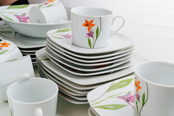cups and plates with the image of flowers 