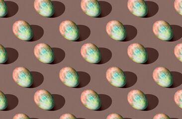 Pattern of easter eggs on brown pastel background