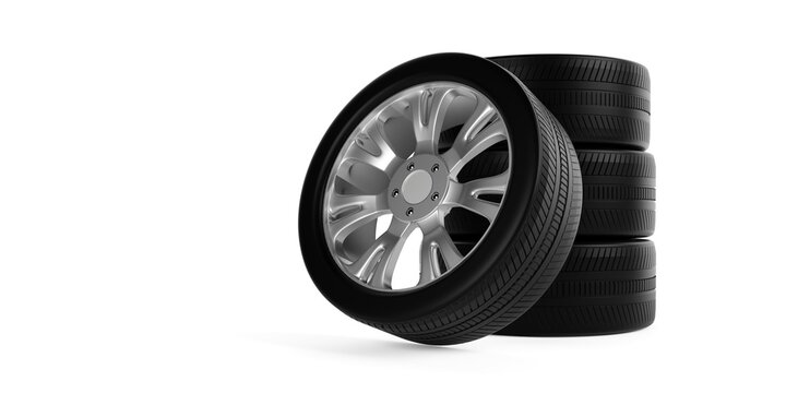 Stack of car tires with single tire leaning against them on white background