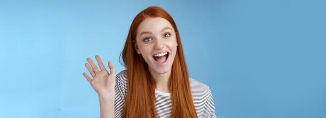 Plakat Hello wanna be friends. Enthusiastic cute redhead female newbie getting know coworkers smiling happy waving raised hand hi greeting gesture welcoming, say bye standing blue background