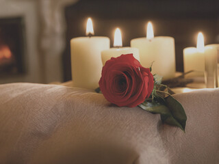 red rose and candle