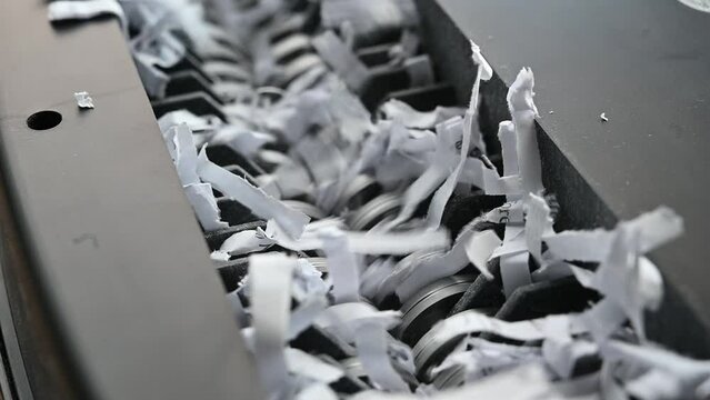 closeup view of office paper shredder teeth 