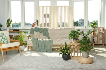 Stylish room interior with modern furniture and beautiful houseplants