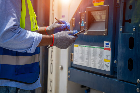 International Shipping Logistics,Logistics Workers Of Forwarder With Tablet Inspect Cargo At Cargo Container Shipping.