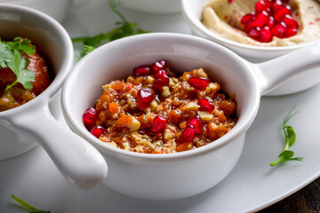 adjika Turkish cuisine on white plate macro close up
