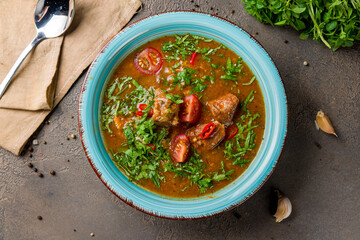 soup kharcho on blue bowl top view