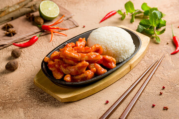 chicken in sweet and sour sauce with boiled rice