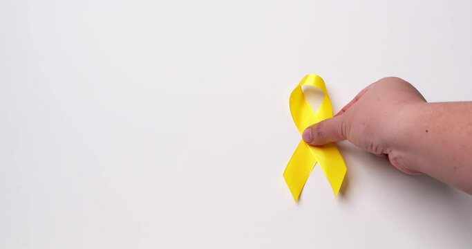 Suicide prevention day, Childhood, Sarcoma, bone, and bladder cancer Awareness month and Yellow Ribbon for supporting people's life and illness. children's Healthcare and World cancer day concept