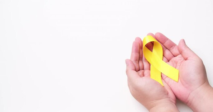 Suicide prevention day, Childhood, Sarcoma, bone, and bladder cancer Awareness month and Yellow Ribbon for supporting people's life and illness. children's Healthcare and World cancer day concept