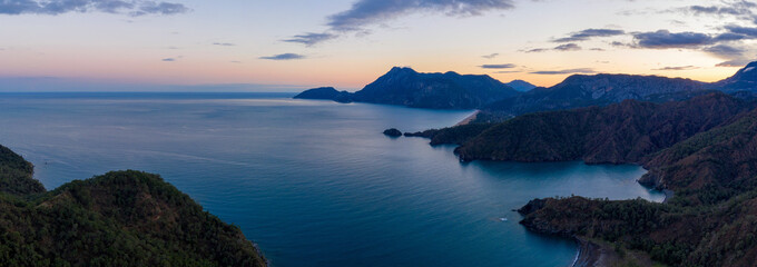 Panoramic aerial view of Mediterranean coastline between Tekirova and Olympos on winter sunset. Turkey.
