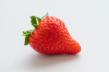 Closeup shot of a red strawberry, white background