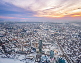 Yekaterinburg city with Buildings of Regional Government and Parliament, Dramatic Theatre, Iset Tower, Yeltsin Center, panoramic view at winter sunset.