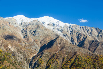 Fototapeta na wymiar Mountain range next to Nanga Parbat mountain peak from Fairy Meadow. Gilgit, Pakistan