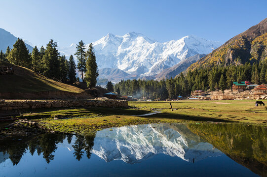 PAKISTAN - September 2021: Nanga Parbat reflection in the lake, beautiful mountain view from Fairy Meadows, Pakistan