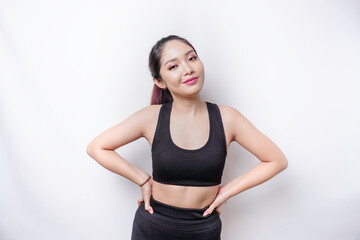 Shot of a sporty young confident woman posing against a white background.