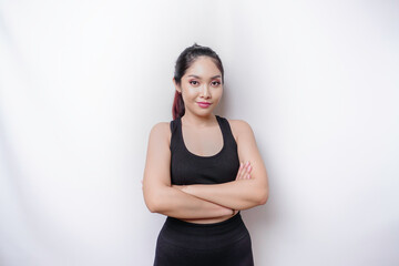 Shot of a sporty young confident woman posing against a white background.