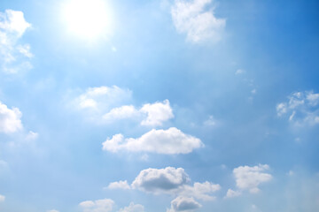 Naklejka na ściany i meble Clouds sun on bright blue sky summer image background