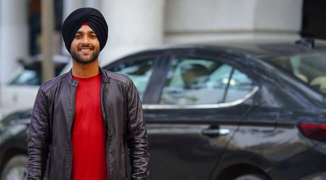 happy Indian Young sikh punjabi boy going office
