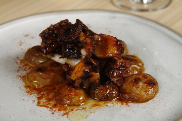 Spicy octopus starter with buttered potatoes and paprika sauce