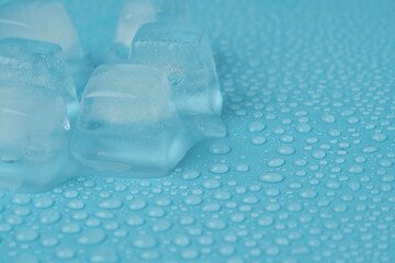 ice cubes with water drops close-up on a blue background