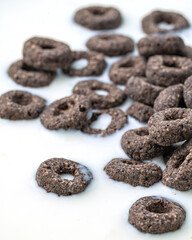Chocolate flakes in milk in the form of rings close-up