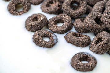 Chocolate flakes in milk in the form of rings close-up