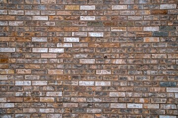 The wall is lined with multicolored kirpich