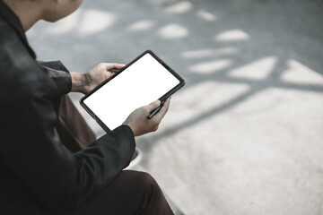 Employees fired or resigned from the company are using tablet to find a jobs..Unemployed, hiring job, quitting job concept.
