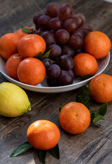 Fruits with vitamin C that are beneficial to the body. Place on sackcloth - orange, grape, lemon