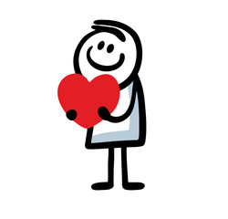 A funny little boy is holding a big heart in his hands as a Valentines Day gift.