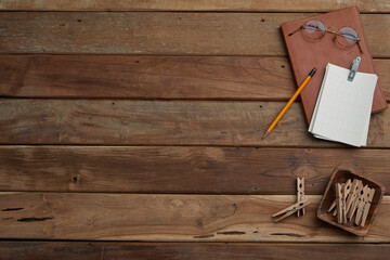 office supplies on the vintage wood table, top view and copyspace