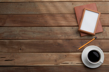 vintage wood table and office supplies with window light