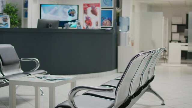 Empty hospital reception desk in waiting area lobby at medical health center, used to help patients with appointments and healthcare insurance. Clinical waiting area with counter.