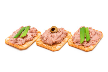 Crispy Salted Crackers with Liver Pate, Green Onions and Olives - Isolated on White. Easy Snack - Isolation