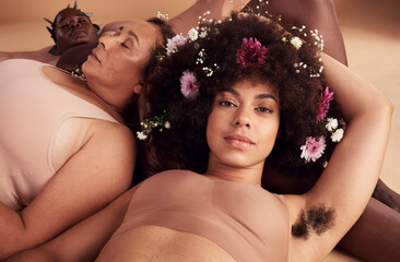 Armpit hair, confidence and floral black woman with natural beauty, body health and happy in skin with a group of women in studio. Creative, flower crown and portrait of a model with hairy underarm - obrazy, fototapety, plakaty