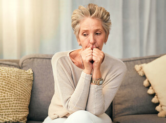 Anxiety, depression and elderly woman on sofa thinking, worry and suffering memory loss in living...