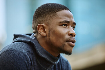 Fototapeta premium Thinking, fitness and black man in the city for running motivation, cardio and commitment to body goal in South Africa. Breathing, health and African athlete runner with vision for urban exercise