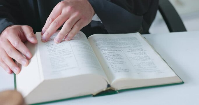 Muslim man, lawyer and reading books in office for court administration, legal consulting and justice. Islamic judge, advisory and advocate attorney studying arabic research for constitution in UAE