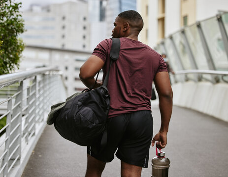 Black Man, Back Or Fitness Bag On City Bridge, Road Or Street With Workout Gear, Training Water Bottle Or Exercise Kit. Runner, Sports Athlete Or Personal Trainer In Urban Travel To Gym For Wellness