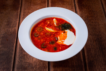 solyanka soup on a wooden background
